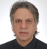 Ο Γιώργος  Καραβόλιας MD, PhD, FESC, FACC